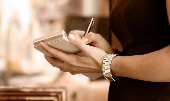 lady writing on order pad in restaurant